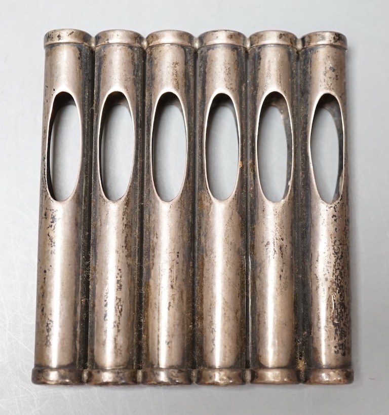 An Edwardian patent novelty cigarette holder, modelled as a magazine of bullets, William Maguires, Birmingham, 1904, 72mm.